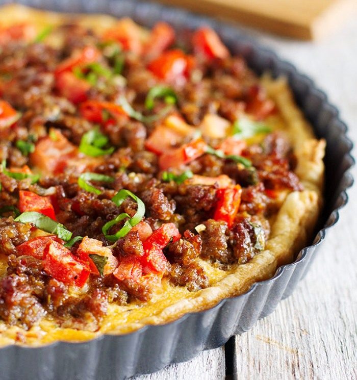 This quiche-like Savory Italian Tart is filled with Italian sausage, tomatoes, eggs and cheese, all on top of a puff pastry crust.