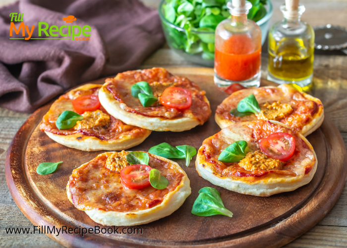 Make these easy mini pizza for snacks from a bought pizza base in a jiffy by cutting out the smaller rounds from the base with a cooky cutter. Top with savory toppings and cheese. Homemade to serve for a platter of treats or snacks recipe.