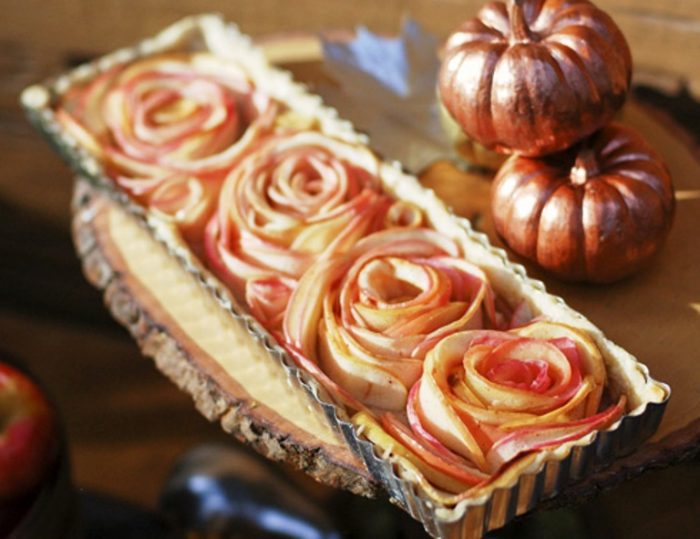 This rose apple pie can be your Thanksgiving dessert and a centerpiece all in one. Thinly sliced apples are shaped into rose shapes in this elegant apple pie.