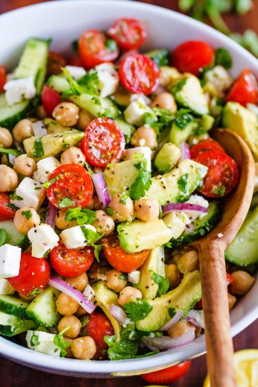 Chickpea Salad loaded with crisp cucumbers, juicy tomatoes, creamy avocado and feta cheese. The fresh lemon dressing adds the Mediterranean flavors of classic Greek Salad.