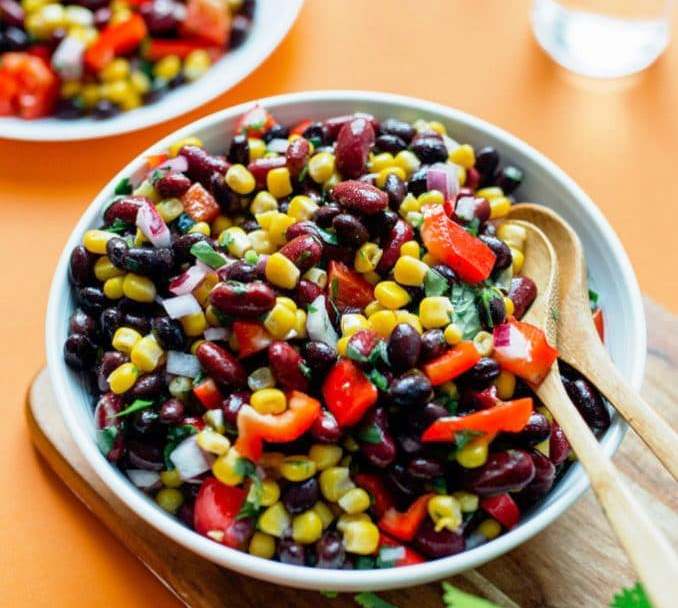 This easy Bean Salad recipe is famous in our house, and for good reason! Quick to make, packed with flavor, and perfect for bringing to potlucks!