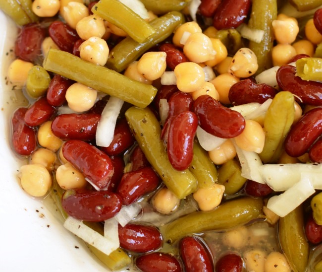 This Three Bean Salad is the best BBQ side dish or summer salad for any potluck! Made with simple pantry ingredients (green beans, garbanzo beans, kidney beans) and is even better as a make-ahead salad! You’ll only need about 10 minutes to make this salad!