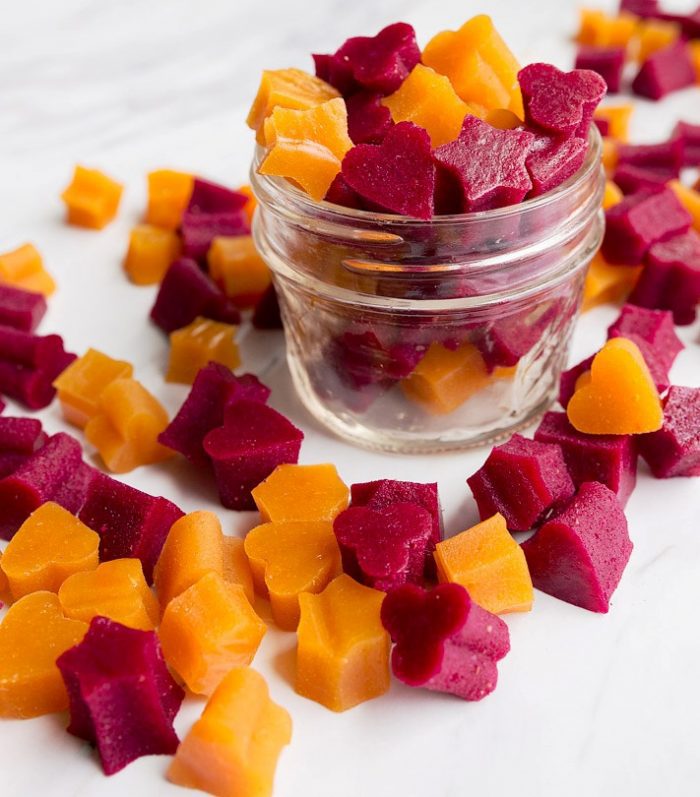 These healthy homemade fruit snacks have the same texture as the store-bought version, but are made with pureed fruit, vegetables, honey, and grass-fed gelatin.