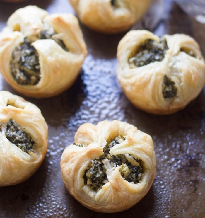 Puff pastry shells are stuffed with a mix of spinach, creamy cashew cheese, garlic and dill, and then baked to flaky perfection to make these mouth-watering vegan spinach puffs.