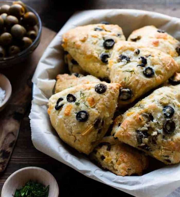 If you love olives and cheesy bread, you will love a fresh batch of Savory Olive Cheese Scones! This scone recipe is great with soup or a glass of wine!