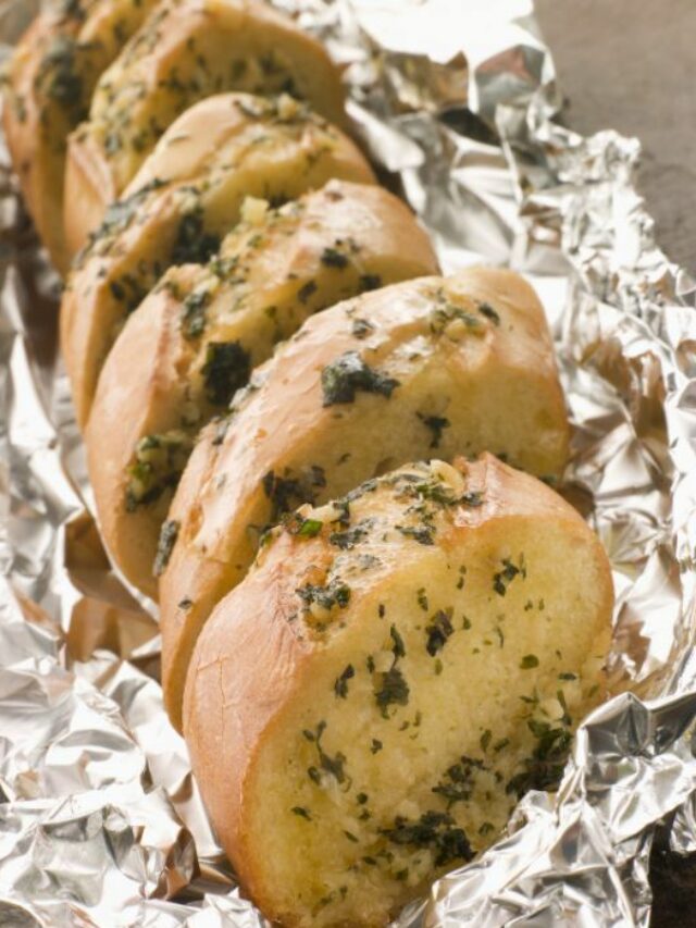 Homemade Garlic Braai Loaf recipe. Easy idea of a loaf, sliced stuffed with garlic, butter and parmesan cheese for starters, grilled in foil.
