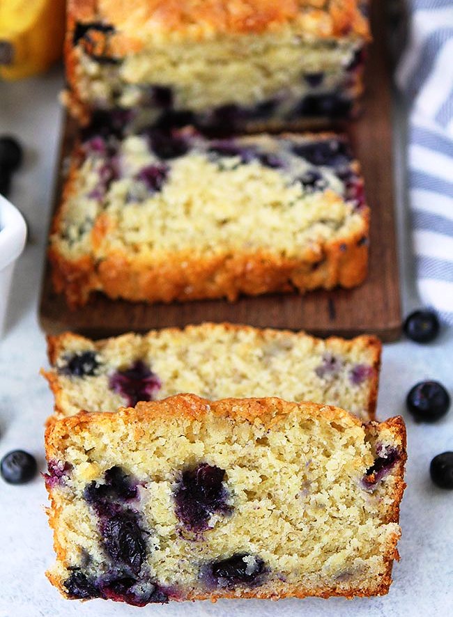 Blueberry Banana Bread-moist, sweet banana bread dotted with juicy blueberries! Enjoy a slice for breakfast, as a snack, or even dessert! This banana bread recipe is a summer favorite when blueberries are in season!