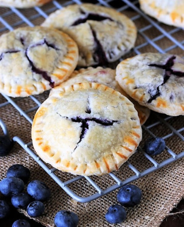 Stuffed full of Mom's homemade fresh blueberry pie filling, Blueberry Pie Cookies are just like eating an adorable mini little blueberry pie