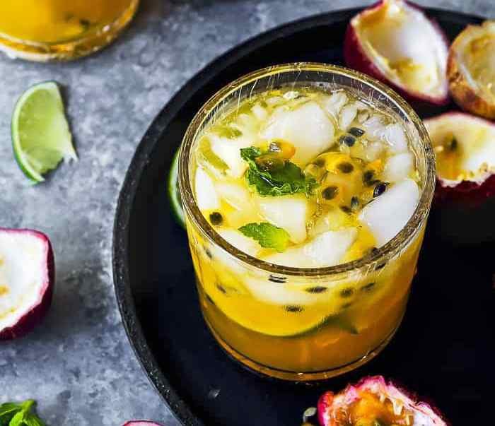 This Passion Fruit Caipiroska is a party in a drink!! Slightly tart, sweet, and super refreshing — this cocktail recipe is made of infused French Vodka, lime, and passion fruit. I dare you to drink just one!!