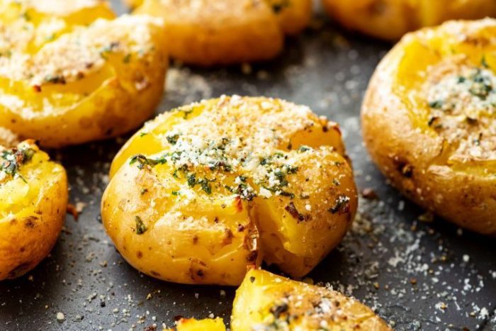Smashed Potatoes are a delicious side dish for the weeknight to get you out of your rut! Crispy potatoes that are brushed with a garlic butter mixture and then seasoned with salt and pepper. Everyone will be begging for seconds!
