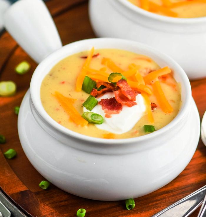 This Crockpot Potato Soup Recipe is easy to make and even easier to eat! It is the ultimate in comfort food. Loaded with bacon, cheese, and potatoes, your family will love this loaded baked potato soup recipe.