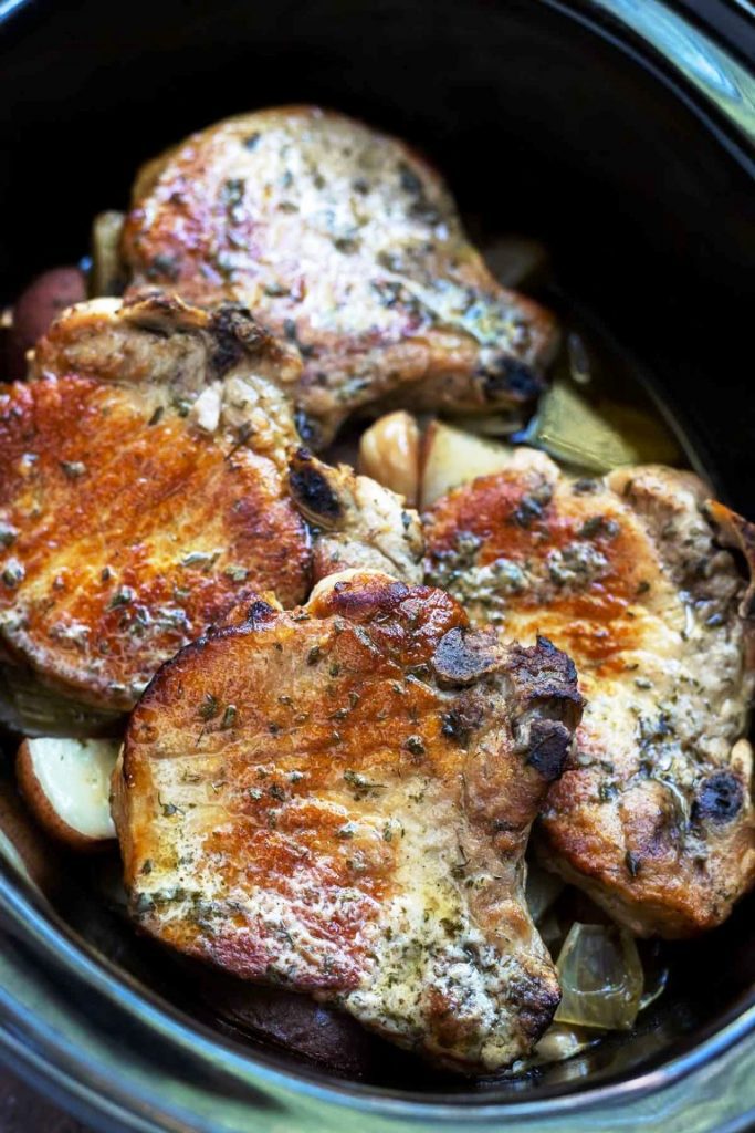 This image has an empty alt attribute; its file name is crockpot-pork-chops-683x1024.jpg