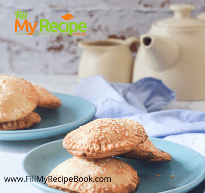 a display of mini homemade apple pie on a plate and tea