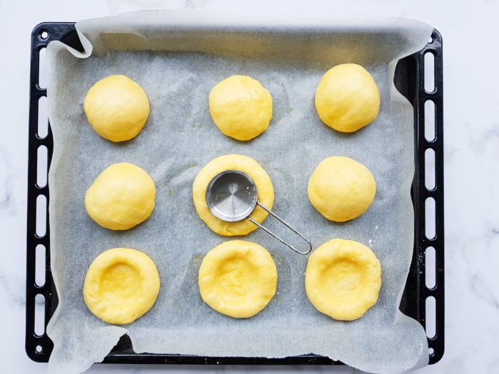 process of making a hollow in the dough for the cream cheese kolache