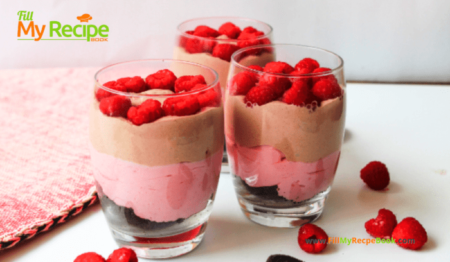 Chocolate Raspberry Cheesecake in a Glass recipe as a dessert. Easy layered whipped cream and cream cheese, cocoa with raspberries parfait.