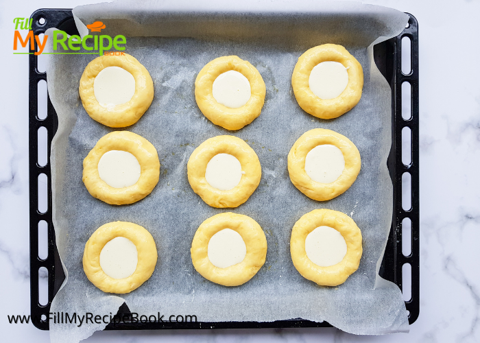 process of filling the cream cheese in the kolache