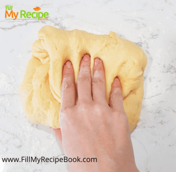 process of needing the dough of cream cheese kolache