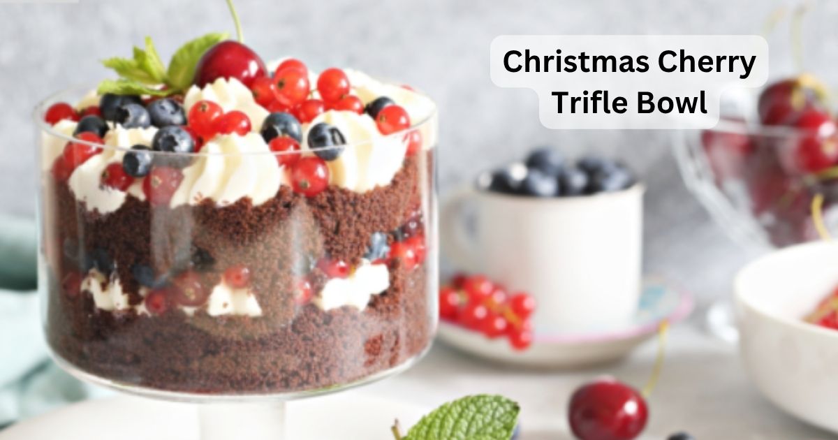 You can clearly see the ingredients in this Christmas cherry trifle bowl. Filled with blueberries, and cranberries as well. Crumbed chocolate sponge with chocolate chips. Then layers whipped cream. Between the layers place whole cherries and blueberries.