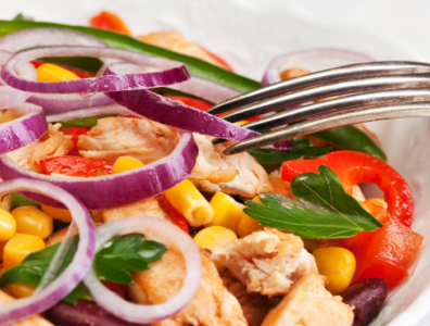 A Filling Homemade Chicken Salad recipe. A colorful bean, corn and cheese and greens, chicken salad that is very filling with homemade sauce.
