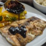 Best Molasses Glazed Oven Baked Salmon Recipe. A seafood dinner with vegetables and rice. Soy and molasses sauce make an amazing glaze.