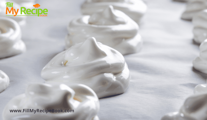 mini meringues on a baking sheet