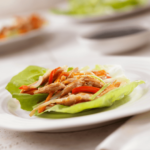 Healthy Asian Chicken Wrap recipe. Asian chicken wrap in a sauce-based gravy folded in a lettuce leaf topped with cashew nut for protein.