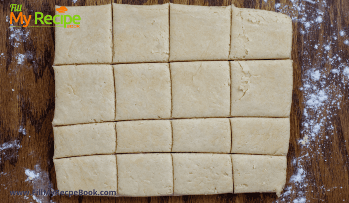 biscuit dough cut into squares for baking
