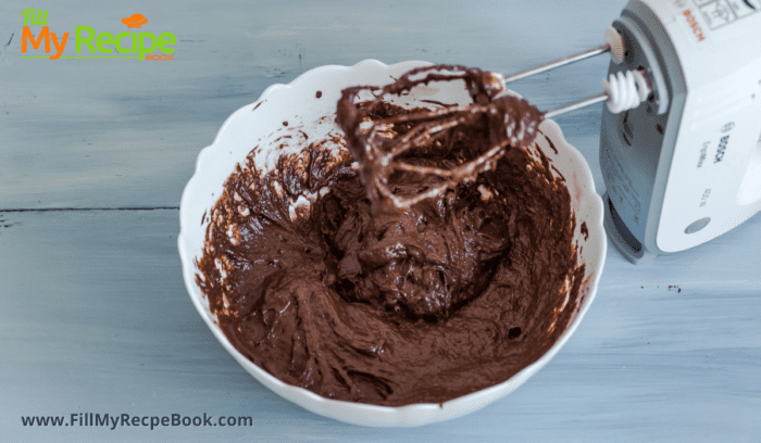 mixing the chocolate cake mix with a hand mixer