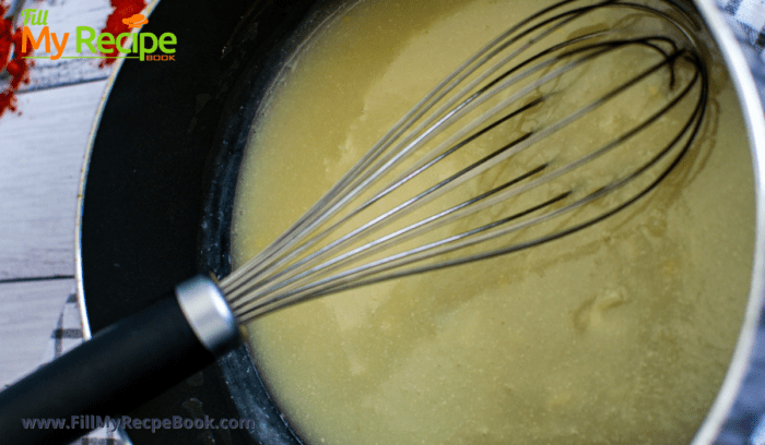 a pan with the garlic sauce being made for lentil cakes