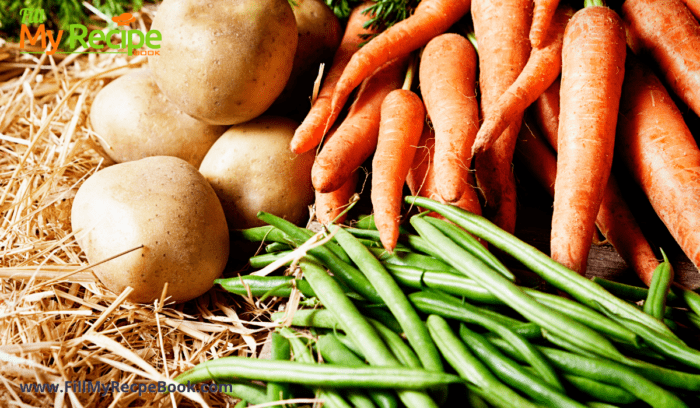 some fresh vegetables like carrots and green beans and potatoes.