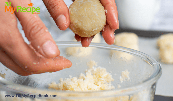 taking the coconut mixture making balls with your hands