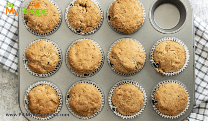 muffin pans with the baked zucchini muffins
