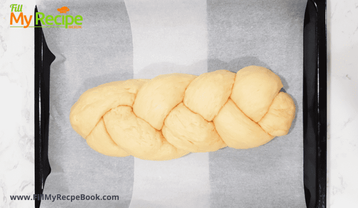 A braided brioche loaf ready to wash with egg and bake