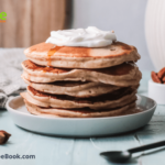 Maple Syrup Drizzled Pancakes recipe. A breakfast with pancakes and syrup or honey and a tower of pancakes with ingredients between for a meal.