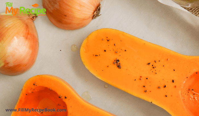 placing the onion and butternut in a roasting pan.