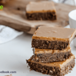 Brownies with Peanut Salted Caramel Sauce Recipe. These Brownies are made with dates, nuts and coconut makes a raw snack with caramel on top.