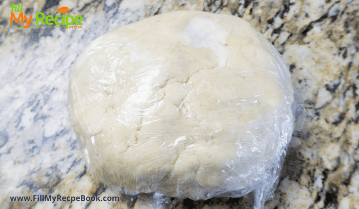 dough wrapped in plastic and placed in the fridge