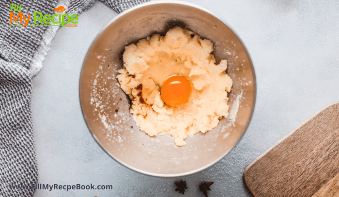 adding an egg in the biscuit mixture