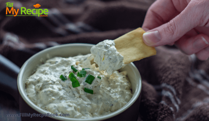 roasted green onion dip in a bowl with crackers