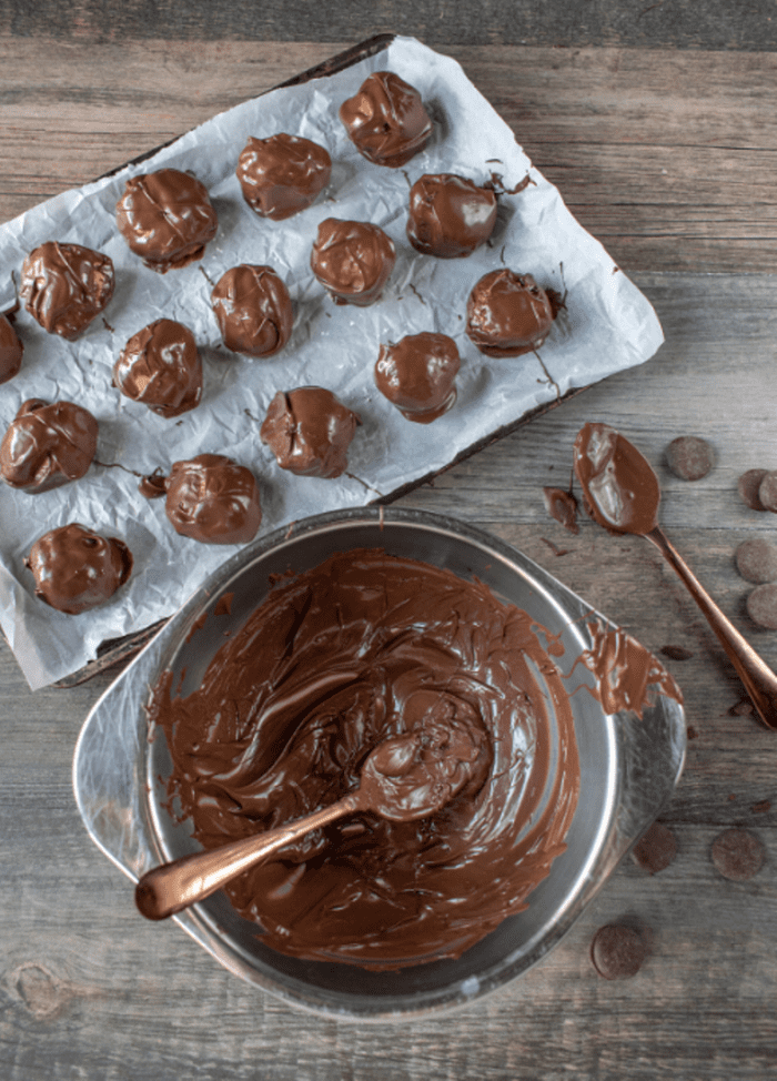 a bowl of melted chocolate for coating the truffles