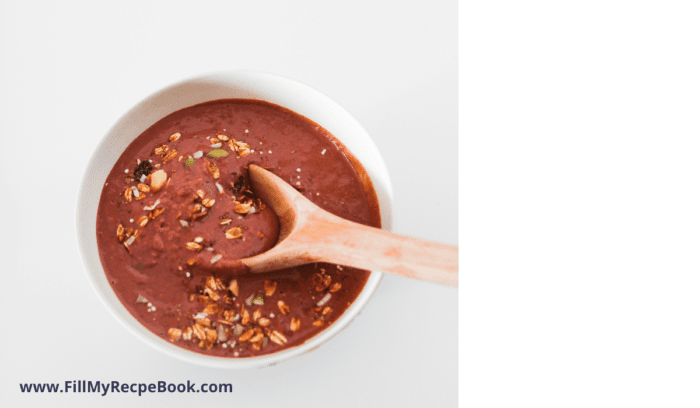 part of the method of making a chocolate blended berry and granola smoothy