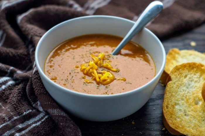 Roasted Tomato and Cheddar Soup. A wonderful and tasty warming tomato and onion and garlic roasted tomato and cheddar soup.