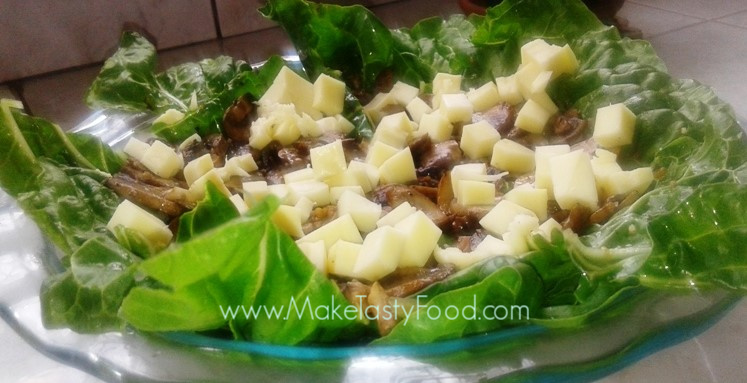 quiche in process with mushrooms and feta