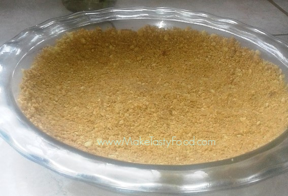 the pressed biscuit and butter base in a pie dish.
