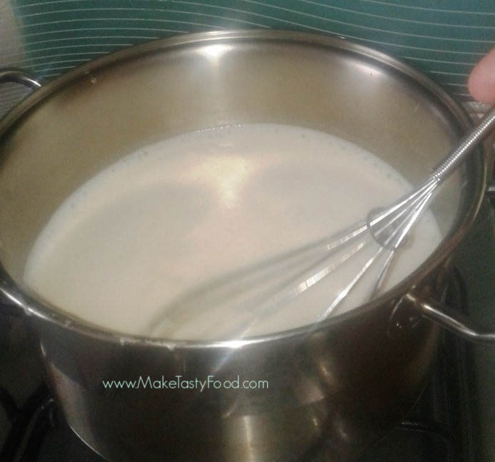 boiling the milk and condensed milk in a pot