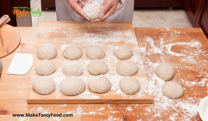 rolling dough into balls for baking on a tray