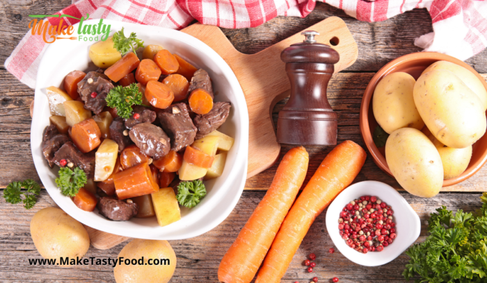 beef stew and vegetables dished up in a bowl.