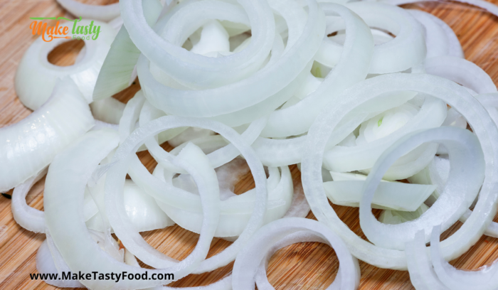 sliced white onions for the pickled fish recipe
