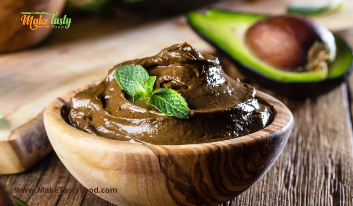 a wooden bowl with healthy avocado mousse
