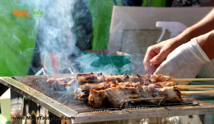 grilling or braaiing the beef sosaties on a braai.